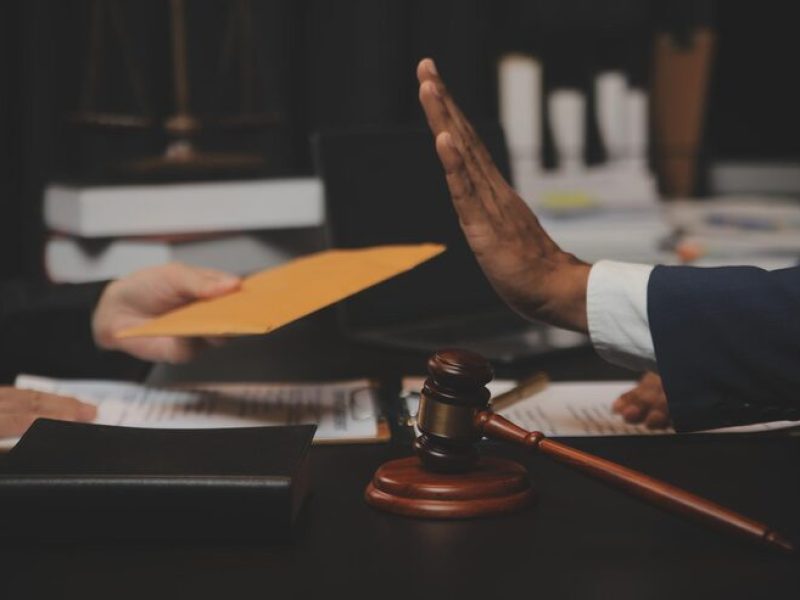 business-lawyers-discussing-contract-papers-with-brass-scale-desk-office-law-legal-services-advice-justice-law-concept-picture-with-film-grain-effect_265022-45186
